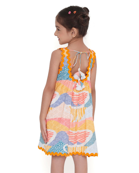 Young girl wearing a colorful Whimsy Hills limited edition sleeveless dress with Schiffli cotton embroidery and yellow lace trim