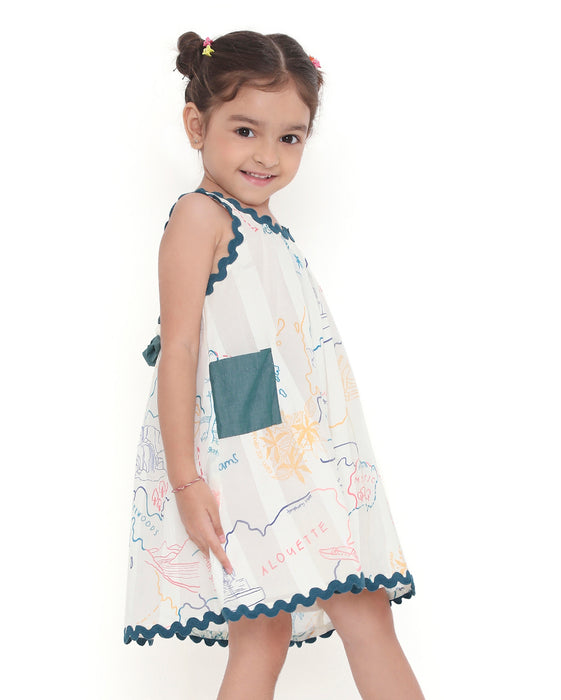 Young girl wearing a sleeveless Voyager Trails cotton dress with multicolour map print and blue lace trim, standing with arms outstretched.