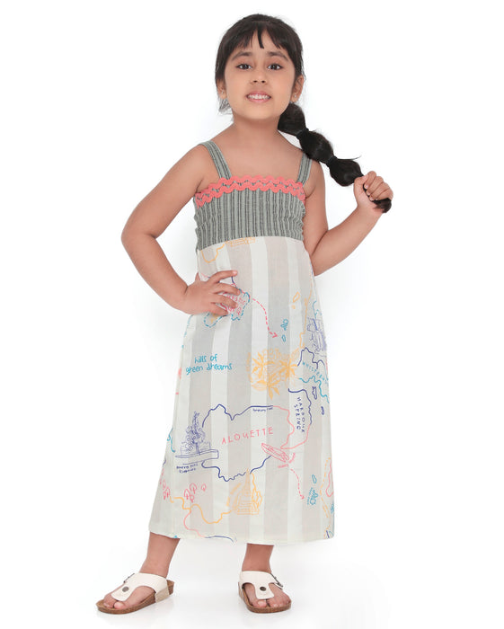 Young girl wearing a Voyager Trails midi dress with a multicolour map print, green striped bodice, and pink lace trim, posing confidently.