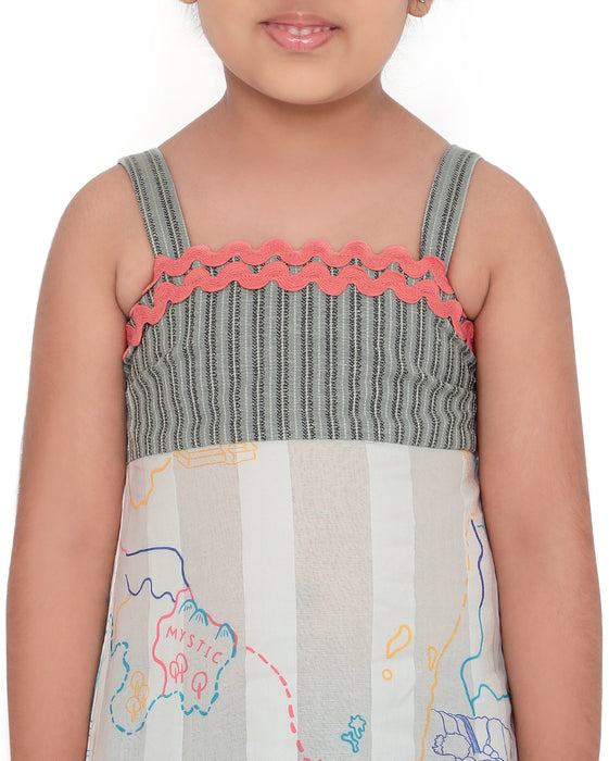 Young girl wearing a Voyager Trails midi dress with a multicolour map print, green striped bodice, and pink lace trim, posing confidently.